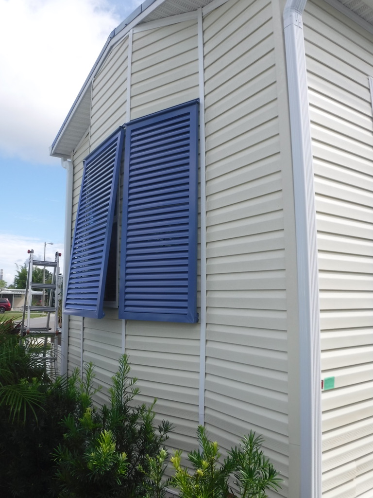 Calmshell awning, bahama shutter